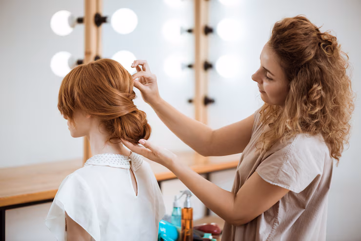 female-hairdresser-making-hairstyle-redhead-woman-beauty-salon_176420-4483